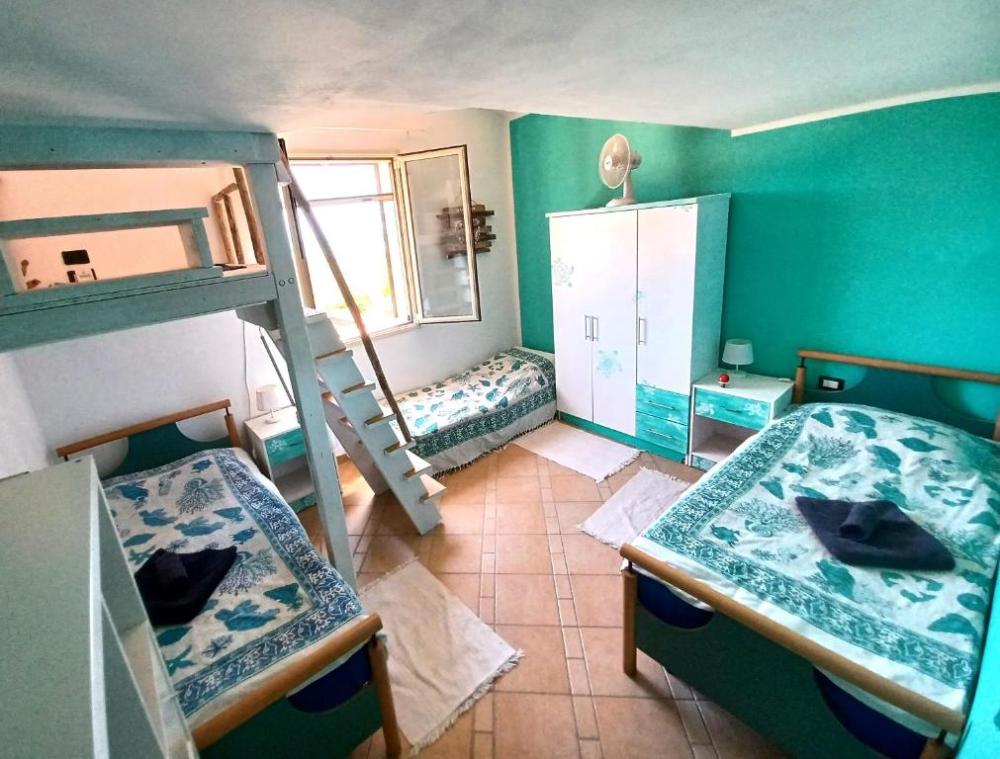 Camera Bahamas - Un letto in un dormitorio misto da 4 letti